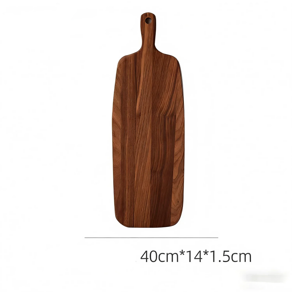 Planche à découper about de bois en acacia avec poignée – en situation